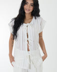 Set pantalon y blusa en tejido de punto tela transparencia ivory
